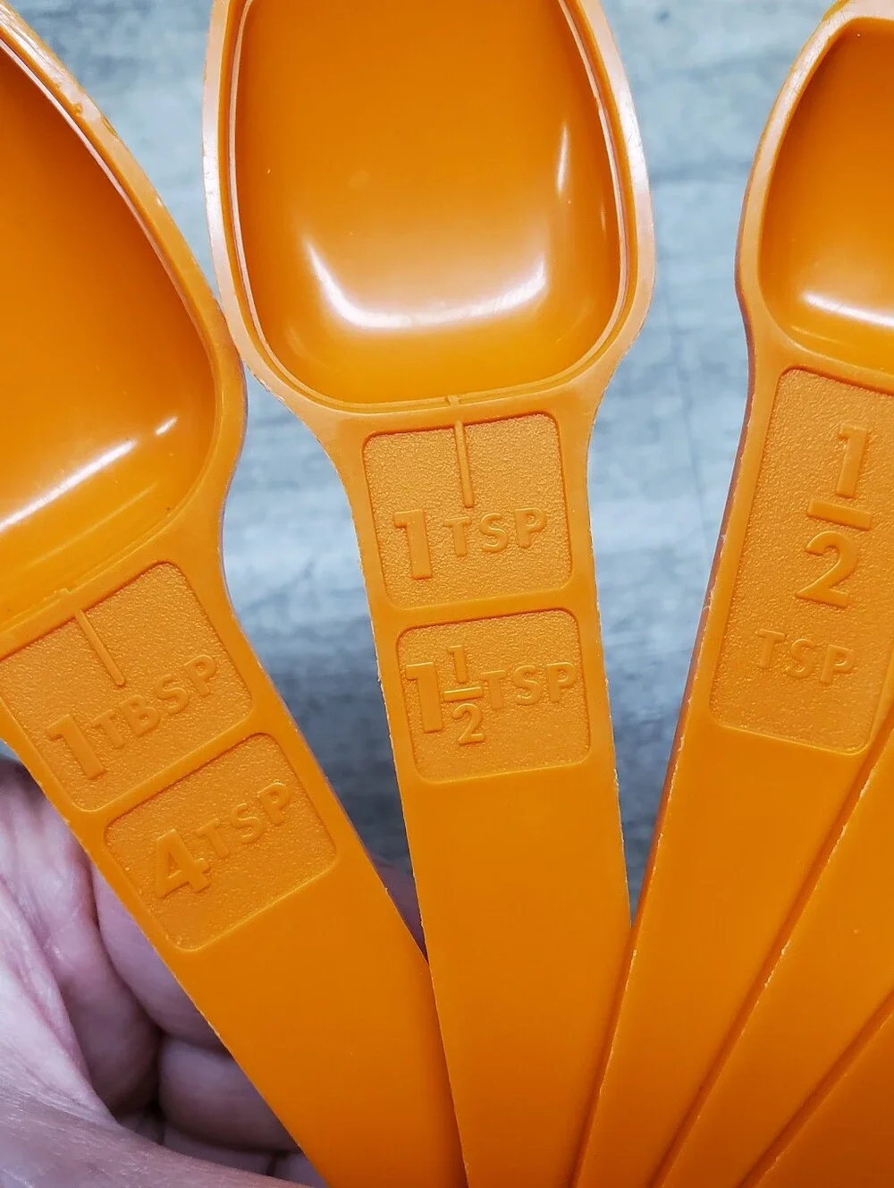 Vintage Tupperware orange measuring spoons